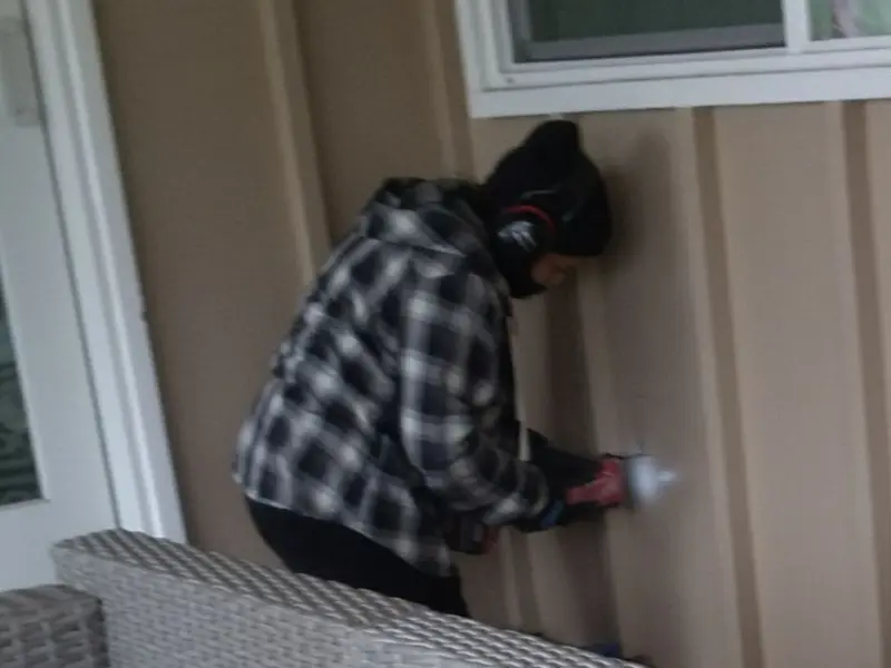 Professional electrician installing an exterior outlet in Almira